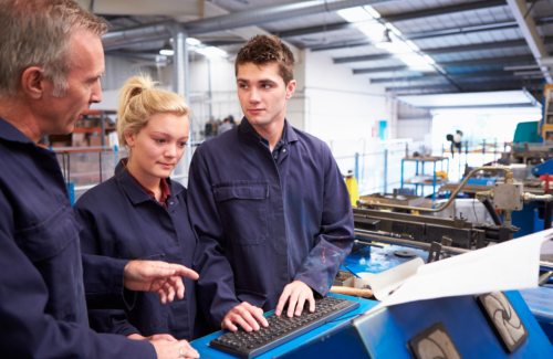 Young apprentices receiving instruction